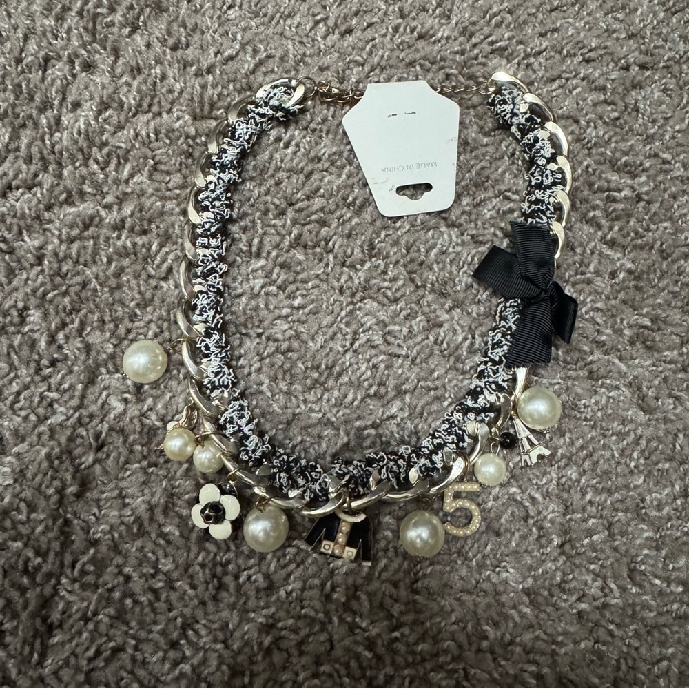 Elegant Gold and Black Charm Necklace